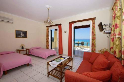 A bed or beds in a room at Natalia Apartment A with panoramic sea views of Agios Gordios bay