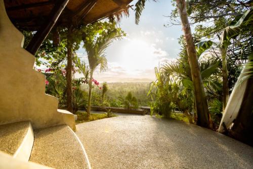 a view from the outside of a house with a driveway at Dome Lombok in Bumbang
