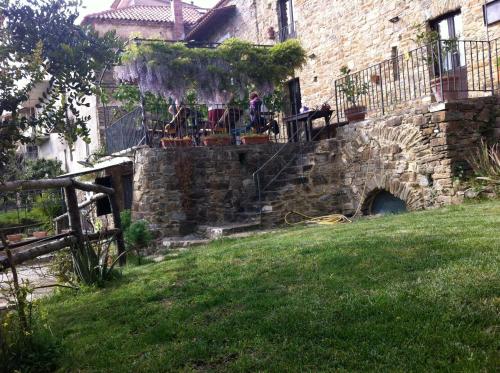a group of people sitting on the stairs of a building at Il Mandorlo in Montecorice