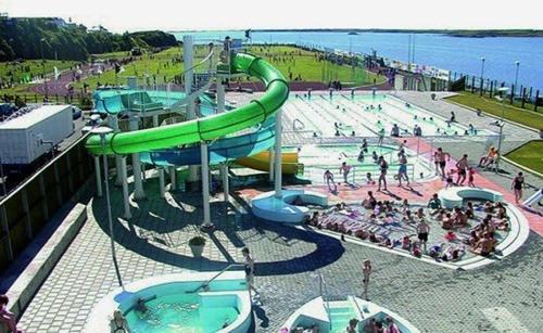 a water park with a water slide and a pool at Beautiful house in the nature of West Iceland in Borgarnes