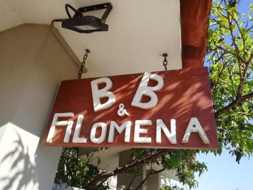 a sign for a b filomonas restaurant at B&B Filomena in Santa Giusta