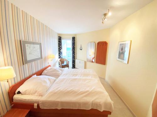Giường trong phòng chung tại Residenz am Yachthafen, Whg 21