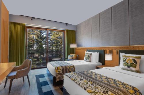Postel nebo postele na pokoji v ubytování Hyatt Regency Dharamshala Resort