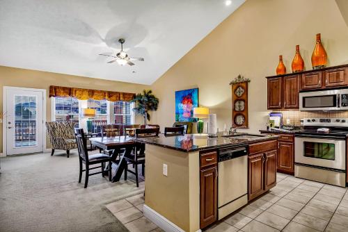 a large kitchen with a table and a dining room at Villa Vista in Hollister