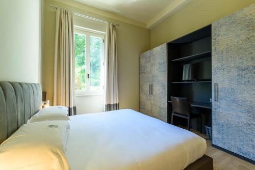 Кровать или кровати в номере Hotel Villa Paradiso