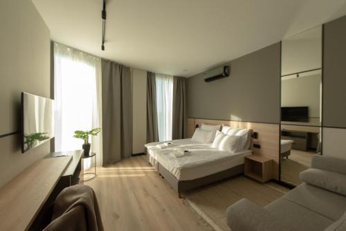 Posteľ alebo postele v izbe v ubytovaní Sarnia Point Apartamenty Prestige