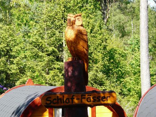 a statue of an owl sitting on top of a building at Holiday Park Auf dem Simpel in Soltau