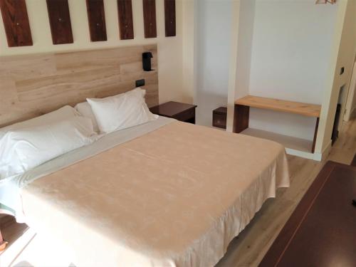 Postel nebo postele na pokoji v ubytování Hotel 153