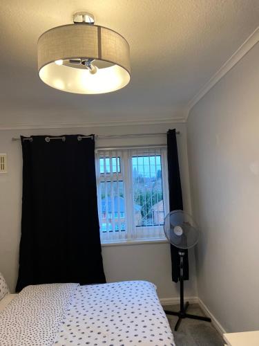 Ένα ή περισσότερα κρεβάτια σε δωμάτιο στο Aylesbury Manor