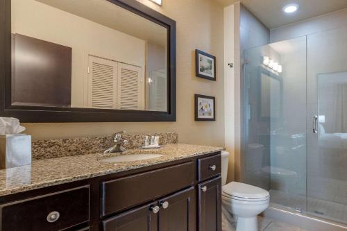 a bathroom with a toilet and a sink and a shower at Comfort Inn Bentonville - Crystal Bridges in Bentonville