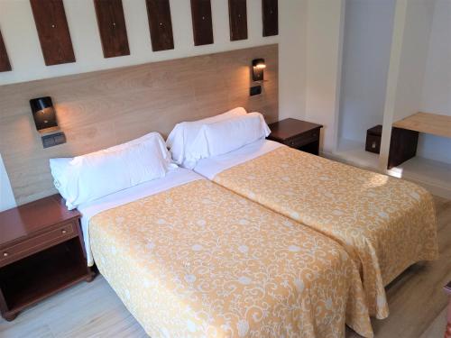 Postel nebo postele na pokoji v ubytování Hotel 153