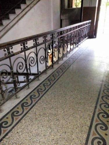 a hallway with a railing in a building at Boutique Fantasy in Tbilisi City