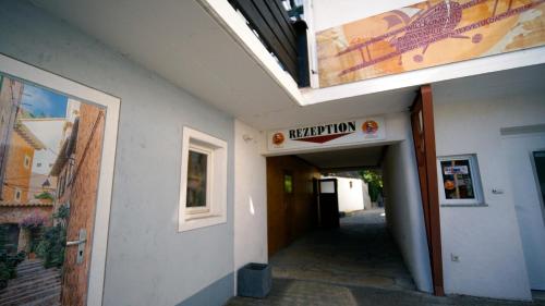 a hallway of a building with a sign for a museum at Gästehaus Parkblick in Rust