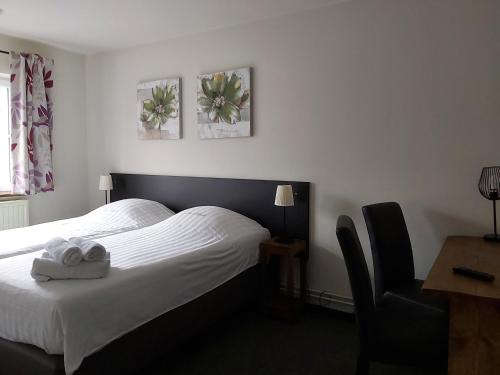 Cama o camas de una habitación en Hostellerie des Tilleuls