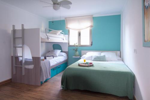 A bed or beds in a room at Frentemar 2 Deluxe