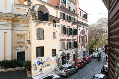 a city street with cars parked in front of buildings at GuestHouse o Affittacamere Magenta Baylon Suite in Rome