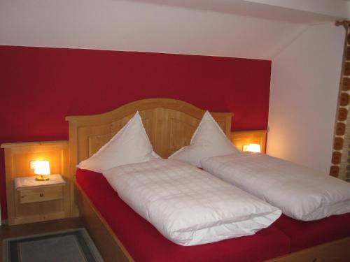 a bedroom with two white pillows on a bed at Gästehaus Bach in Oberstdorf