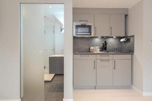 Kuchyň nebo kuchyňský kout v ubytování Studioapartment - Tom