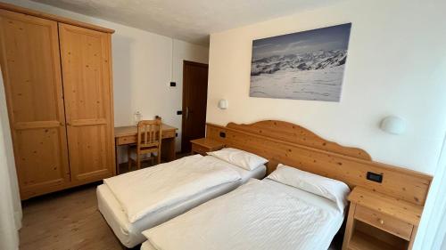 Ein Bett oder Betten in einem Zimmer der Unterkunft Hotel Zanella