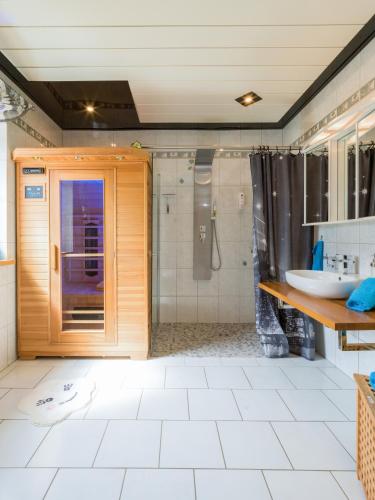 a bathroom with a shower and a sink at Benkelberg in Sitzerath