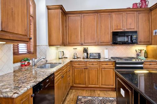 a kitchen with wooden cabinets and a sink at 44 Aspen Meadow Drive in Edwards