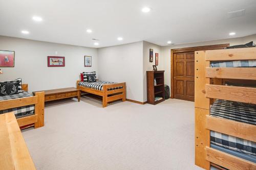 a bedroom with a bunk bed and a room with bunk beds at 44 Aspen Meadow Drive in Edwards