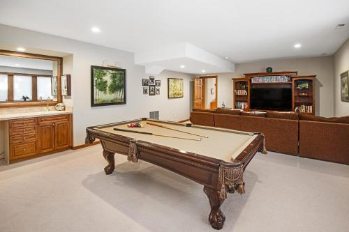 a living room with a pool table and a couch at 44 Aspen Meadow Drive in Edwards