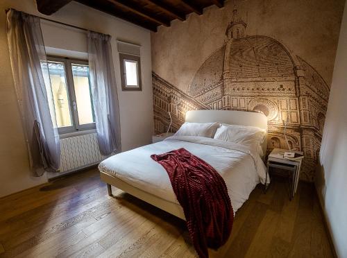 A bed or beds in a room at Acacia Firenze - Girasole