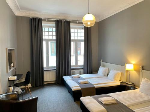 Postel nebo postele na pokoji v ubytování Unique Hotel