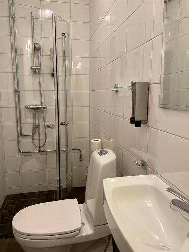 Ванная комната в Unique Hotel
