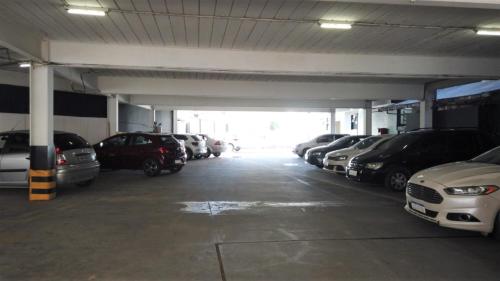 a parking garage with cars parked in it at Ano Bom Palace Hotel in Barra Mansa