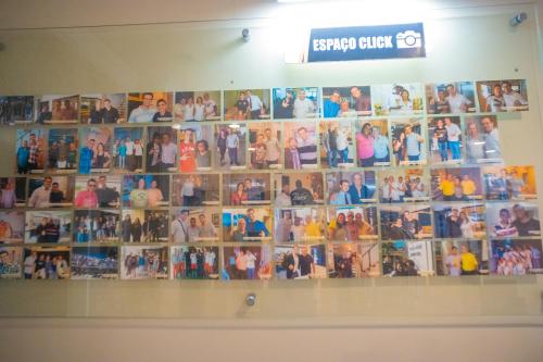 a collage of photos on a wall at Ano Bom Palace Hotel in Barra Mansa