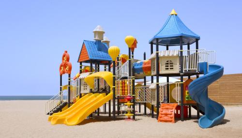 a playground on the beach with a slide at InterContinental Aqaba by IHG in Aqaba