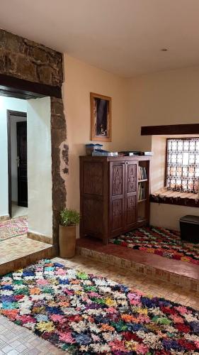 a room with a large rug on the floor at Touda Ecolodge Atlas Mountains in Zawyat Oulmzi