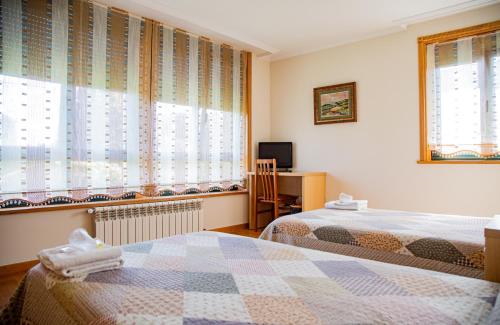 Postel nebo postele na pokoji v ubytování A Lúa do Camiño