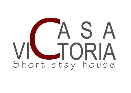 znak, który brzmi jak "V torana short stay house" w obiekcie Casa Victoria IUN Q5032 w Cagliari