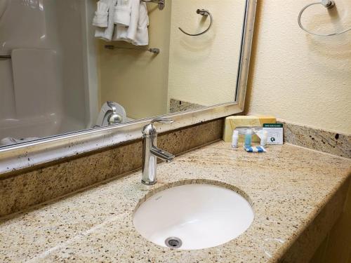 a bathroom counter with a sink and a mirror at Ocean View Studio-Sun N Sand 603 in Myrtle Beach