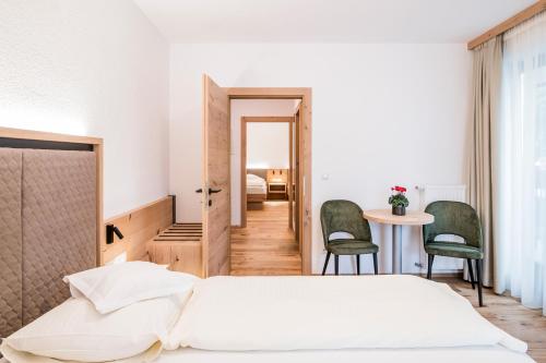 מיטה או מיטות בחדר ב-Hotel Sterzinger Moos