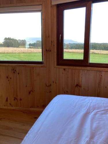 Postel nebo postele na pokoji v ubytování Domos Puerto Varas