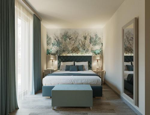 a bedroom with a large bed and a large window at PFA Hotel Viareggio in Viareggio