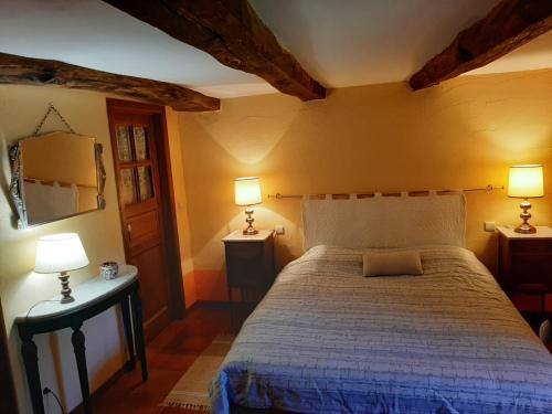 Кровать или кровати в номере La Maison des Marguerites