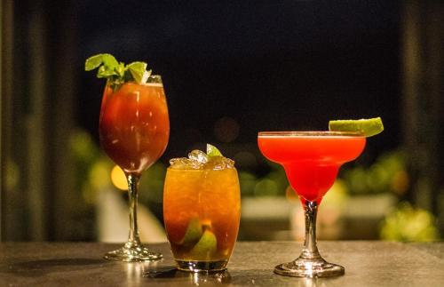 a group of three cocktails sitting on a table at Philippos Xenia Hotel in Serres