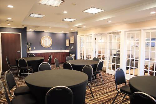 a meeting room with tables and chairs in it at Baymont by Wyndham Jackson/Ridgeland in Jackson