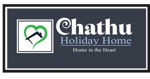 a sign with the wordsuth holiday home home in the heart at Chathu Holiday Home in Kandy