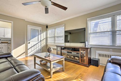 a living room with a couch and a table at Long Island Apt with Shared Yard, Near Golfing! in East Meadow