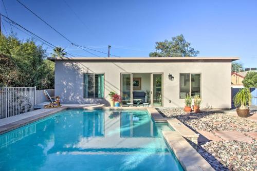 a home with a swimming pool in front of a house at Less Than 3 Mi to U of A Poolside Oasis in Tucson! in Tucson