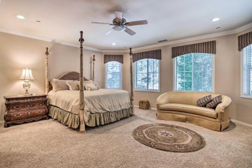 a bedroom with a bed and a ceiling fan at Huge Lake Arrowhead Home with 3 Decks and Grill! in Lake Arrowhead