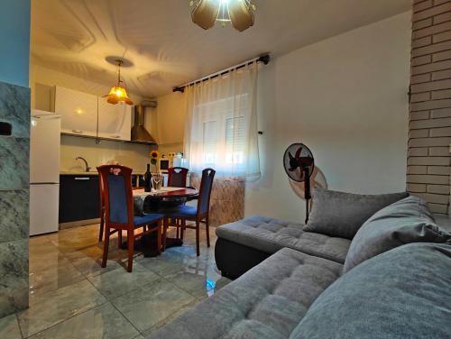 a living room with a couch and a table at Amazing View in Podstrana