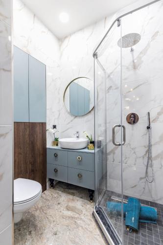 a bathroom with a sink and a shower at Lovely apartment Traku str. in Vilnius