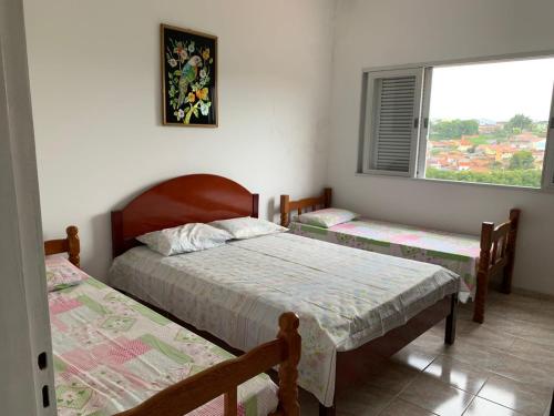 A bed or beds in a room at Casa de hospedagem providências